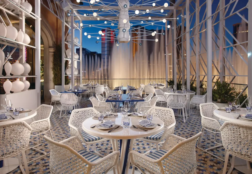 Bellagio dinner terrace with string lights, set for a Rooftop Under the Lights corporate event theme