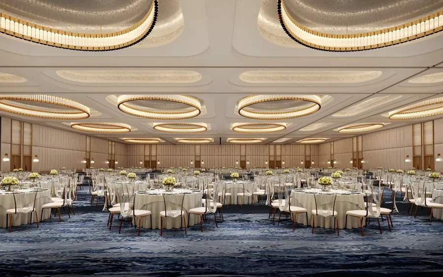Spacious Las Vegas ballroom venue at Fontainebleau ideal for large corporate events and gala dinners, featuring circular chandeliers and elegant décor.